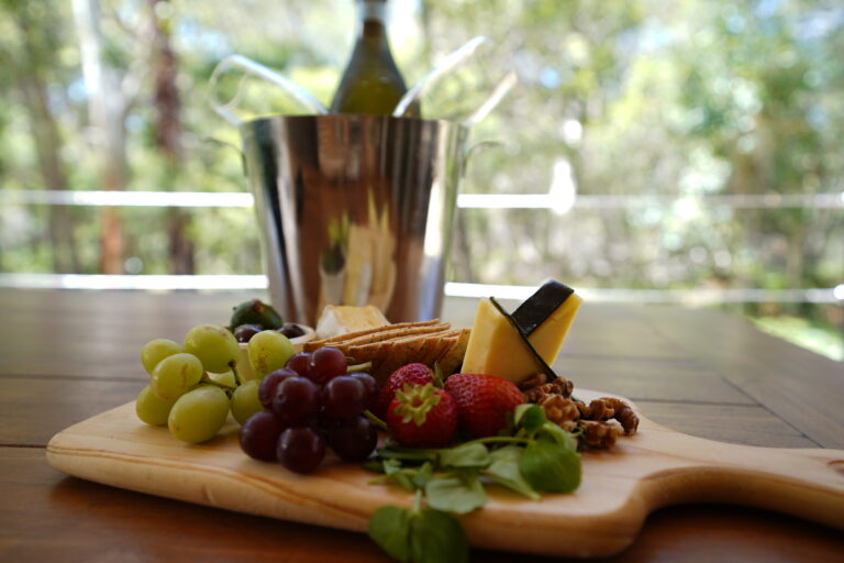 Noosa Glamping & Graze Cheese & Wine platter overlooking deck and bushland